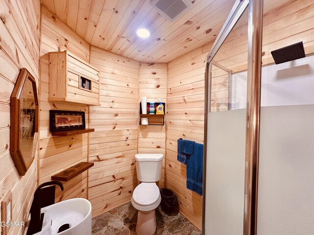 bathroom featuring wood walls, toilet, a shower with door, and wooden ceiling