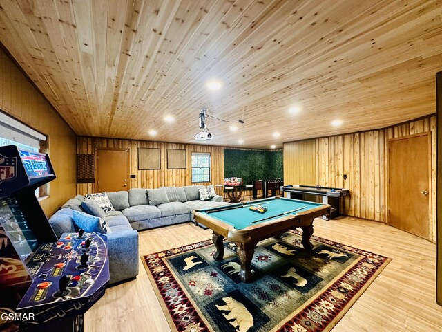 playroom with light wood-type flooring, pool table, wood walls, and wood ceiling