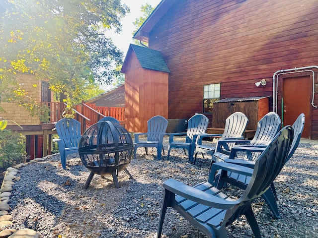 view of yard with a fire pit