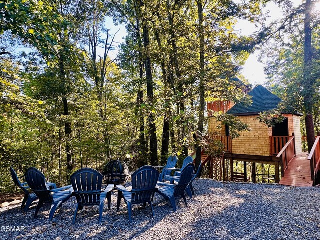 view of yard with a fire pit and a deck