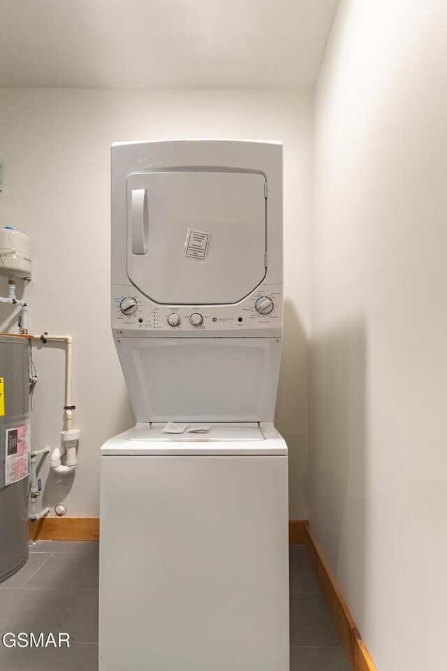 706 Kelly St, Gatlinburg, TN 37738 - washroom with stacked washing machine and dryer and tile patterned flooring