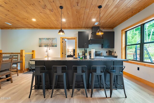 706 Kelly St, Gatlinburg, TN 37738 - kitchen featuring premium range hood, wooden ceiling, a breakfast bar area, recessed lighting, and dark countertops