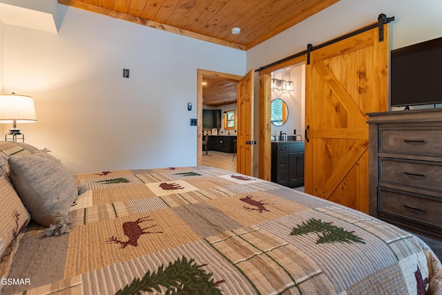 706 Kelly St, Gatlinburg, TN 37738 - bedroom with wood ceiling and a barn door