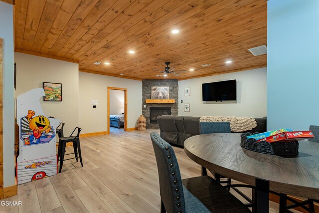 706 Kelly St, Gatlinburg, TN 37738 - dining room with ceiling fan, a fireplace, recessed lighting, wood ceiling, and light wood-style flooring