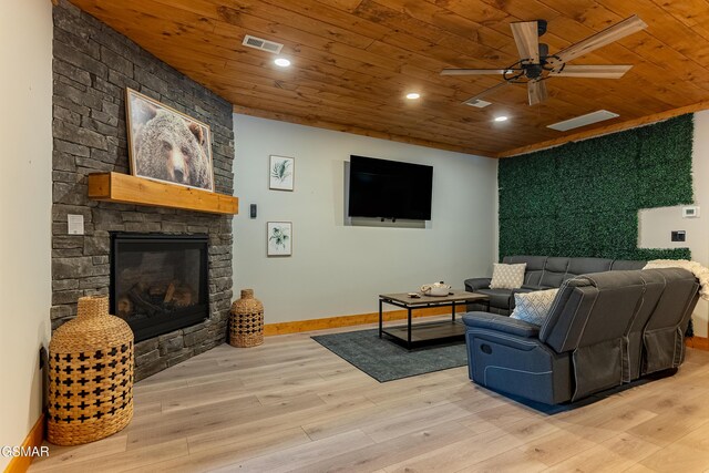 706 Kelly St, Gatlinburg, TN 37738 - living area with wood ceiling, a ceiling fan, wood finished floors, an outdoor stone fireplace, and recessed lighting