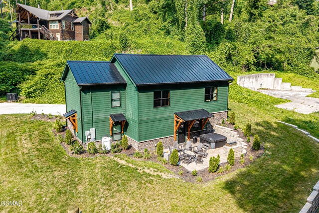 706 Kelly St, Gatlinburg, TN 37738 - rear view of property with a patio area, a yard, a metal roof, and a view of trees