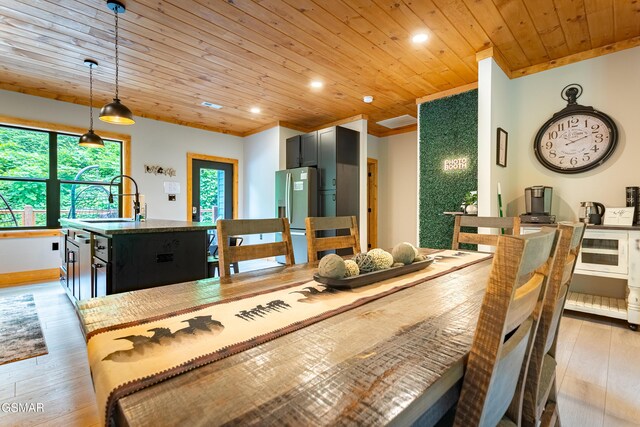 706 Kelly St, Gatlinburg, TN 37738 - dining area with wood ceiling, light wood finished floors, recessed lighting, and ornamental molding