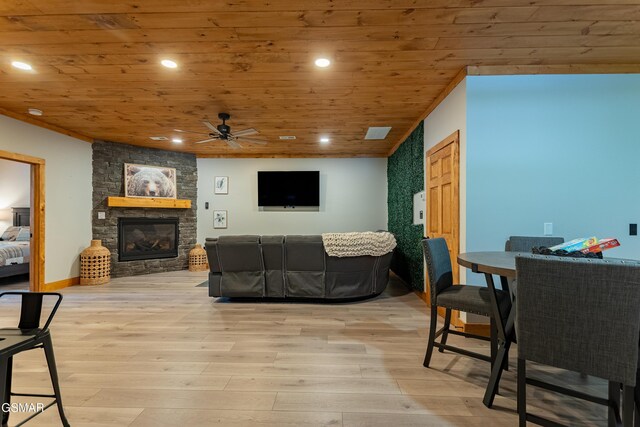 706 Kelly St, Gatlinburg, TN 37738 - living room with ceiling fan, wooden ceiling, a stone fireplace, light wood-style flooring, and recessed lighting