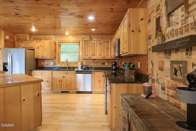 kitchen with sink, wooden ceiling, stainless steel appliances, and light brown cabinetry