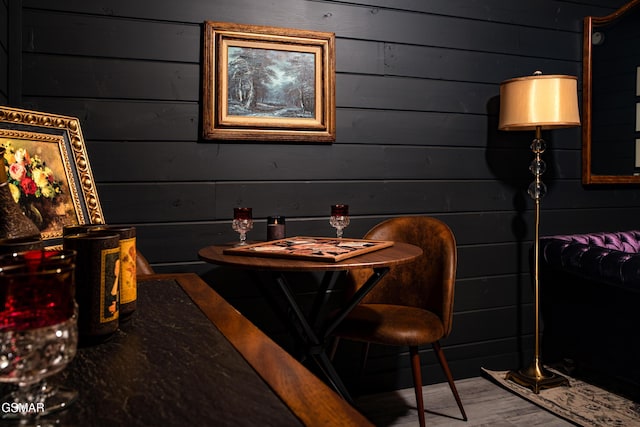 dining room featuring wood walls