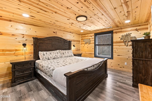 bedroom with wood walls, wood ceiling, and dark wood-style floors