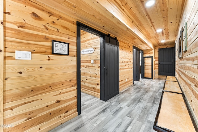 corridor featuring recessed lighting, wood finished floors, wooden walls, and wooden ceiling