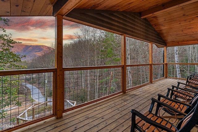 wooden deck featuring a mountain view