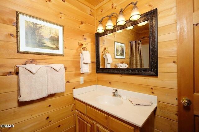 448 Silver Maple Ln, Gatlinburg, TN 37738 - bathroom featuring vanity, wooden walls, and a shower with curtain
