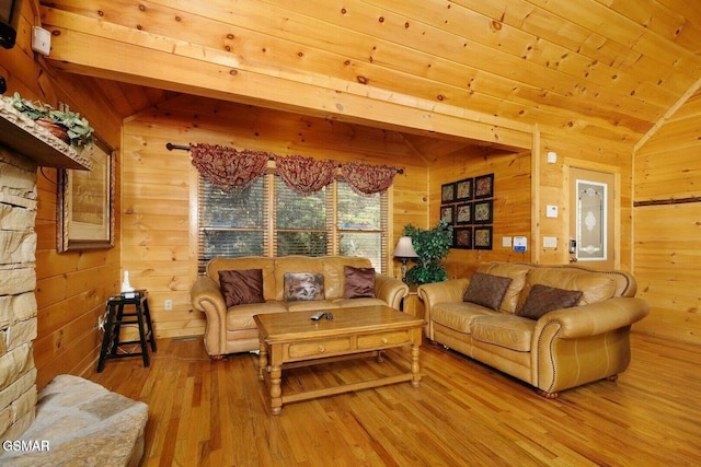 living room with lofted ceiling, wood walls, wood-type flooring, and wood ceiling