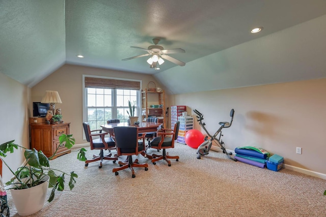 carpeted dining area with lofted ceiling, ceiling fan, and a textured ceiling