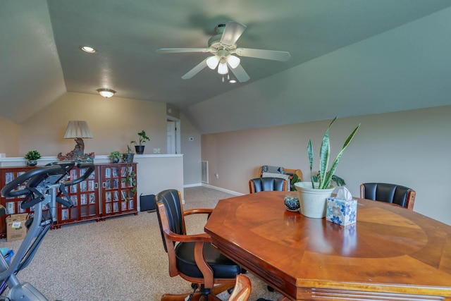 carpeted dining area featuring ceiling fan and lofted ceiling