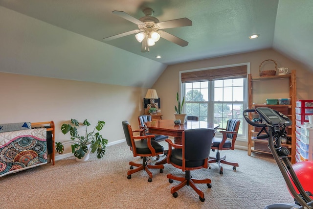 office space with carpet flooring, ceiling fan, and lofted ceiling