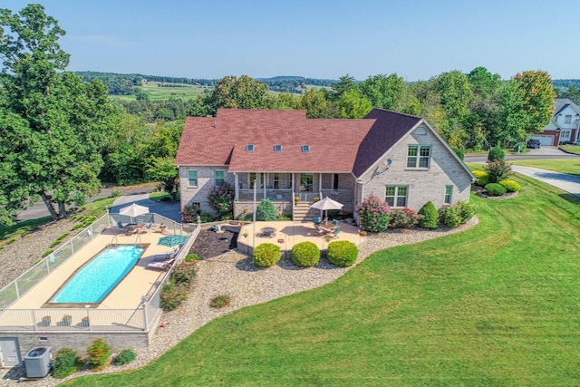 rear view of property featuring central AC and a patio area