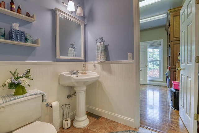 bathroom featuring toilet and tile patterned floors