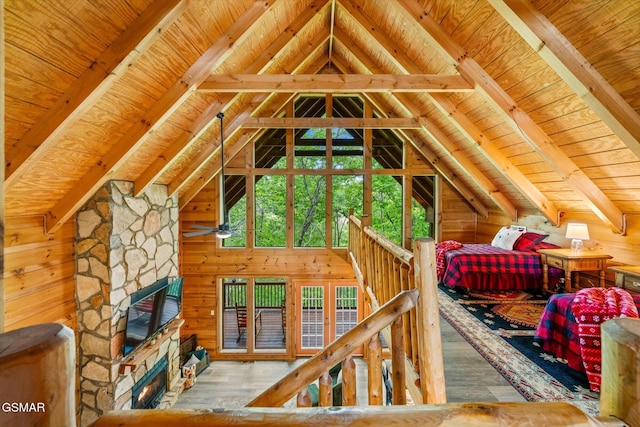 3216 Emerald Springs Loop, Sevierville, TN 37862 - bedroom featuring wood ceiling, wood finished floors, a stone fireplace, wooden walls, and access to exterior