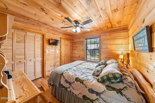 3216 Emerald Springs Loop, Sevierville, TN 37862 - bedroom featuring wood ceiling, wood finished floors, wood walls, and a ceiling fan
