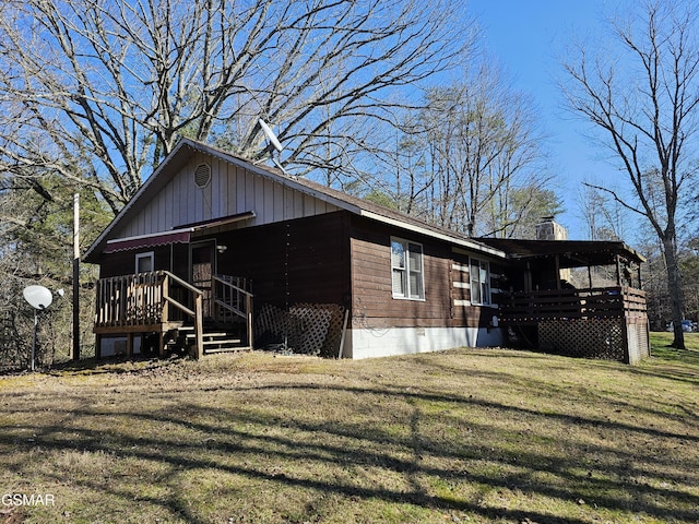 820 Old Gate Rd, Pigeon Forge, TN 37863 - view of side of home featuring a lawn and a wooden deck