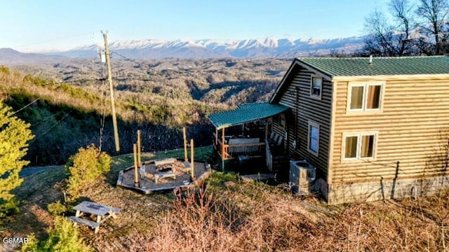 exterior space featuring metal roof and a mountain view