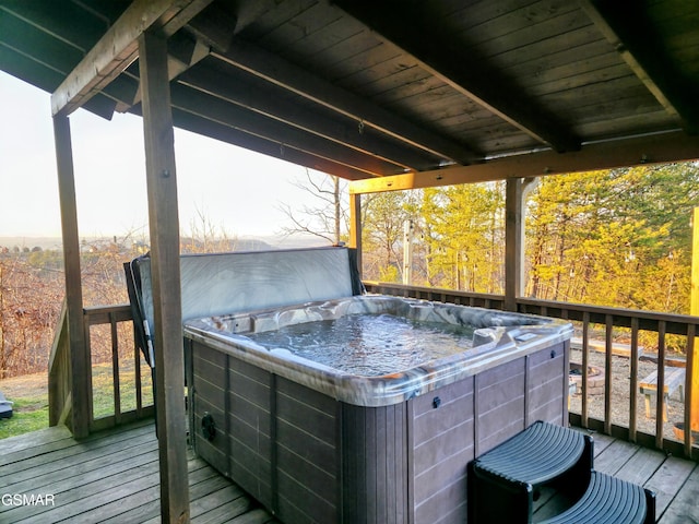 deck with a hot tub