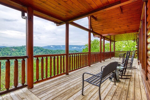 wooden deck with a mountain view