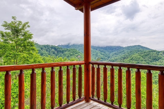 wooden terrace featuring a mountain view