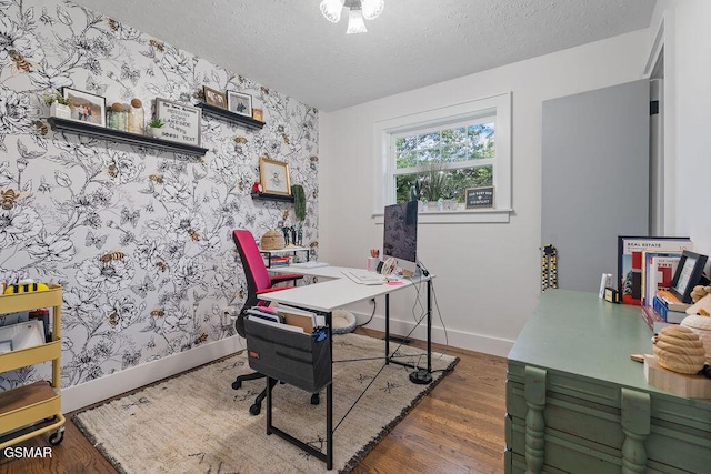 4325 San Juan Ln, Knoxville, TN 37914 - office space featuring wallpapered walls, a textured ceiling, baseboards, wood finished floors, and an accent wall
