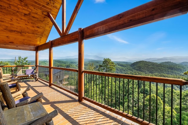 wooden deck with a mountain view