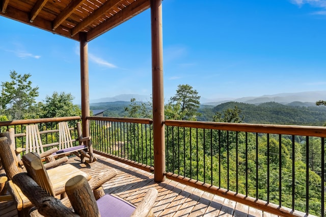 wooden deck featuring a mountain view