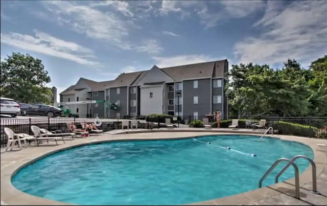 view of swimming pool with a patio area