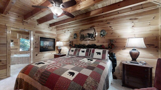 bedroom featuring light carpet, beam ceiling, ceiling fan, and wood ceiling