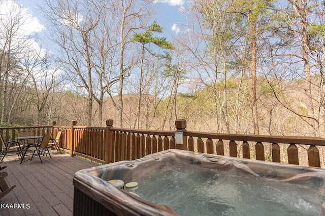 deck with a hot tub