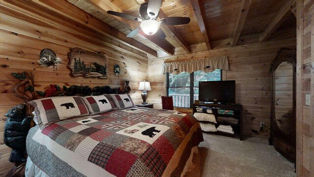 bedroom with beamed ceiling, carpet floors, wood walls, and wood ceiling