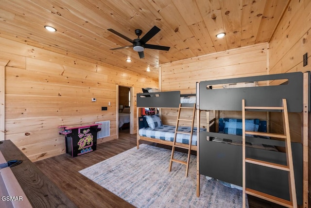 bedroom with wood-type flooring, wooden ceiling, and wood walls