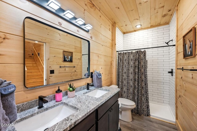 bathroom featuring wood ceiling, a sink, wood walls, and a shower stall