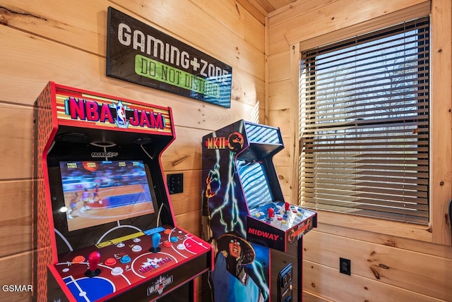 recreation room with wood walls