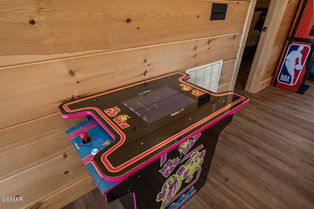 playroom featuring dark wood-type flooring