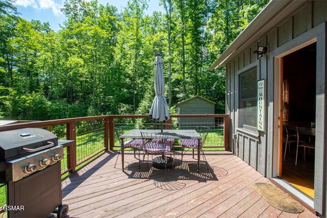 3637 Marshall Ln, Sevierville, TN 37862 - wooden deck featuring grilling area and outdoor dining area