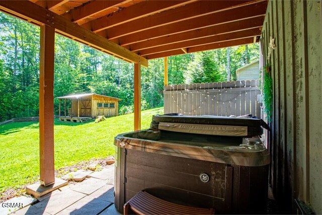 3637 Marshall Ln, Sevierville, TN 37862 - view of patio / terrace featuring an outbuilding and a hot tub