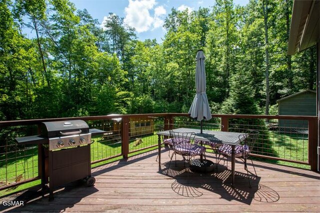 3637 Marshall Ln, Sevierville, TN 37862 - wooden deck featuring area for grilling and outdoor dining space