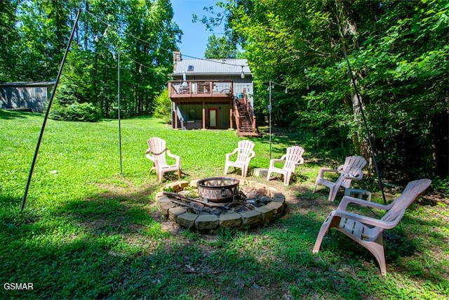 3637 Marshall Ln, Sevierville, TN 37862 - view of grassy yard with stairway, a fire pit, and a wooden deck