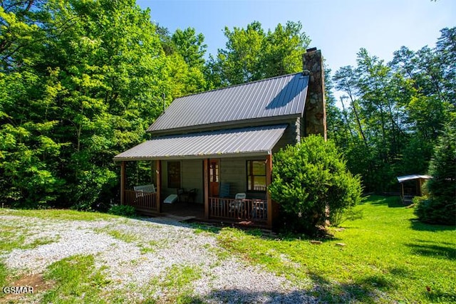 3637 Marshall Ln, Sevierville, TN 37862 - view of front of house featuring a porch, a chimney, and a front lawn