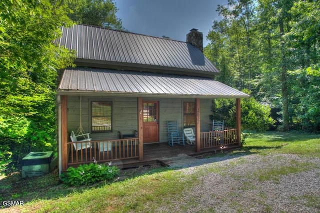 3637 Marshall Ln, Sevierville, TN 37862 - view of front of property featuring a porch, a chimney, and a metal roof