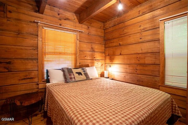 3637 Marshall Ln, Sevierville, TN 37862 - bedroom with a wooden ceiling with exposed beams, wooden walls, and wood finished floors
