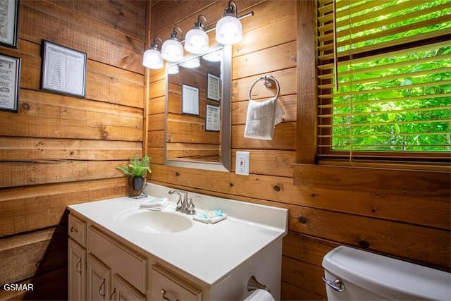 3637 Marshall Ln, Sevierville, TN 37862 - half bathroom featuring wooden walls and vanity